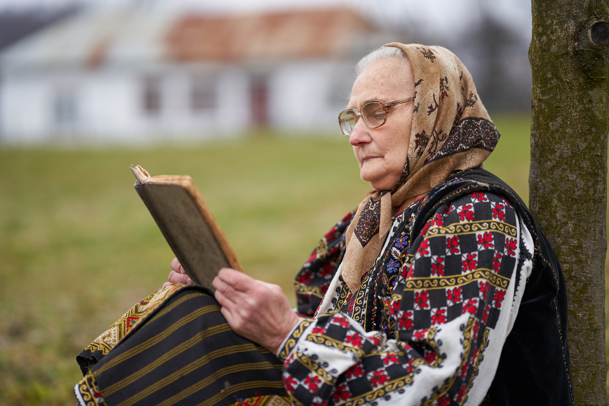 Old Woman Reading a Book Outdoor